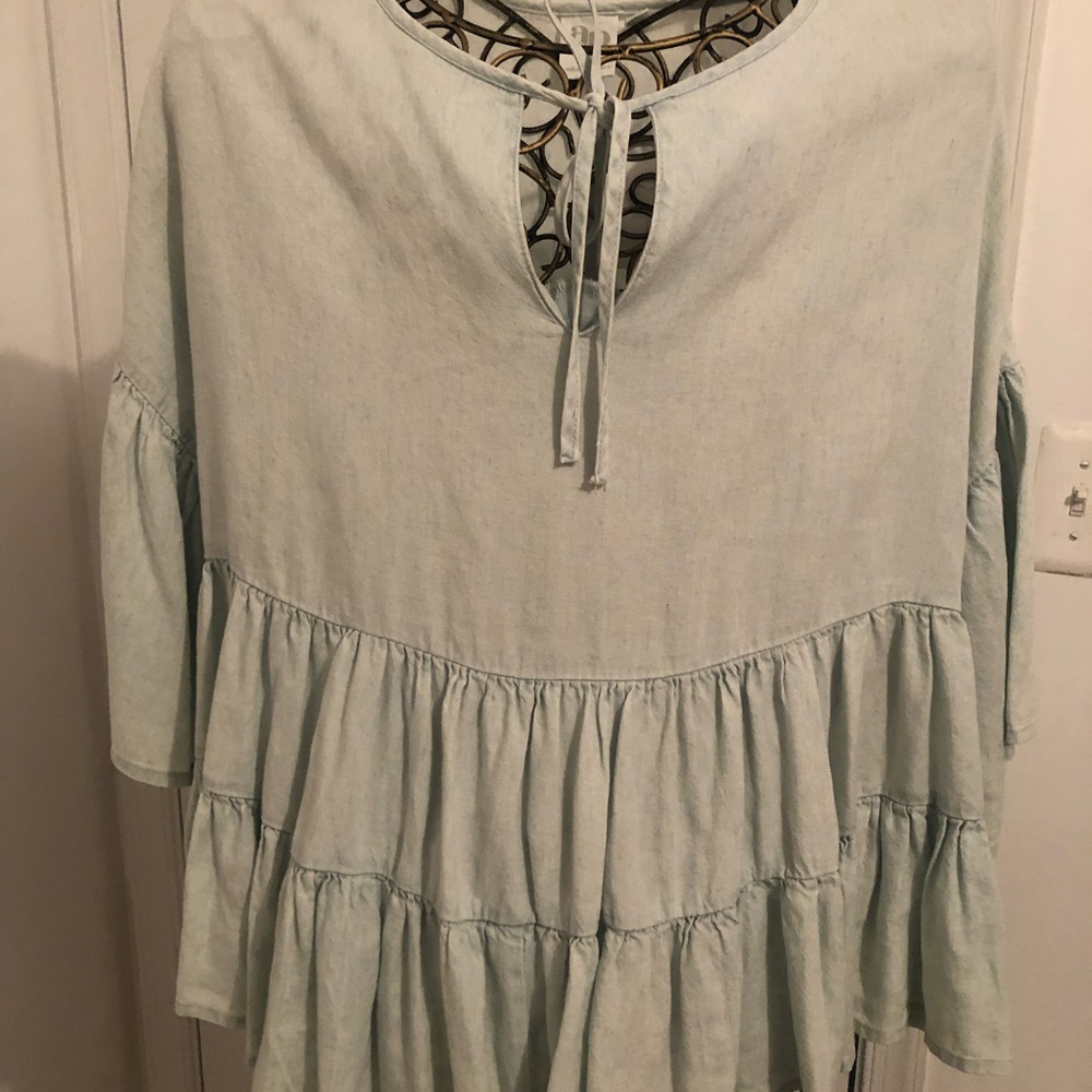Top with ruffle bottom and bell sleeves keyhole tie in front